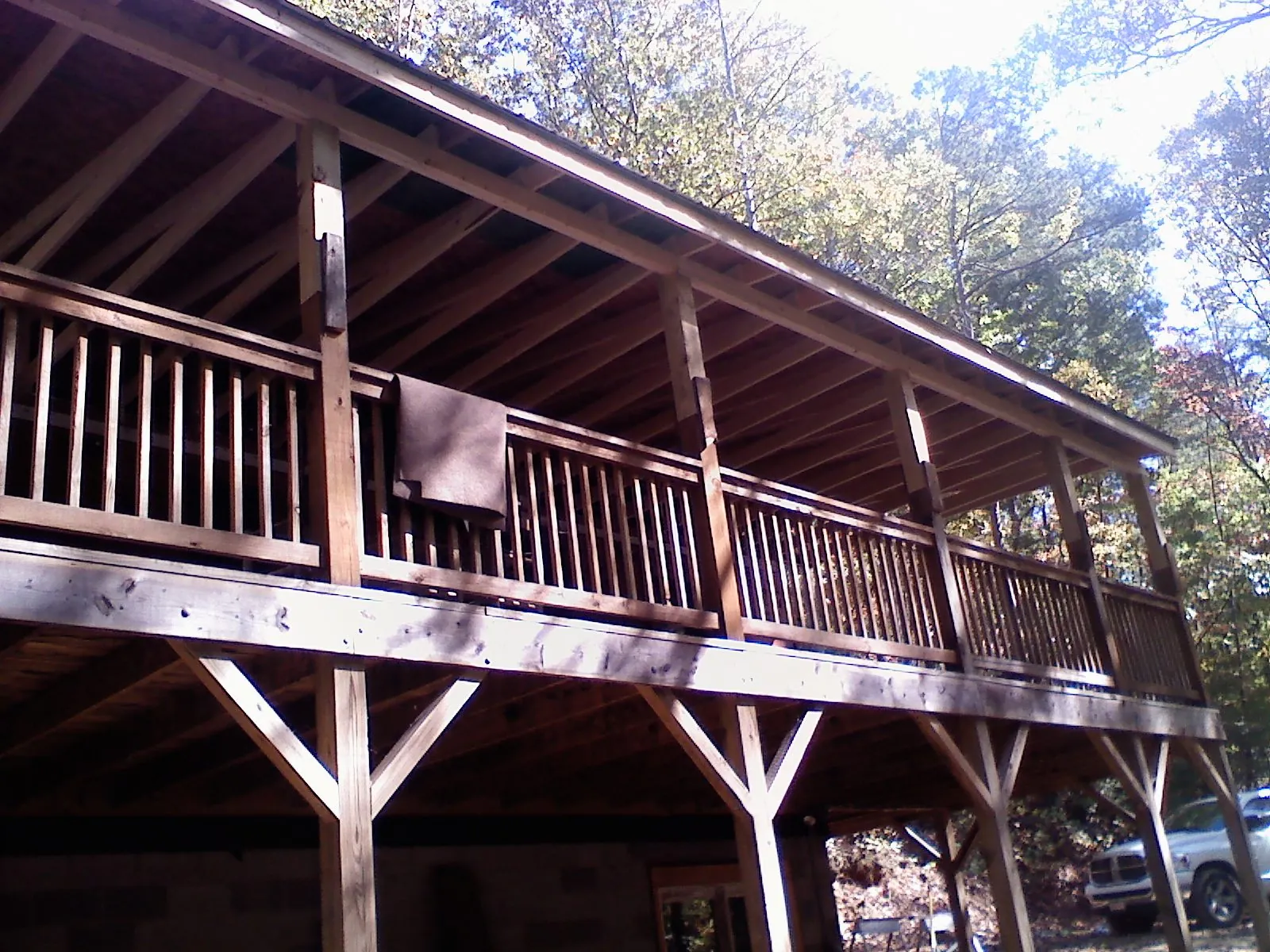 Timber framing under a new elevated porch and deck — Roof Leak Repair in Palmer Lake by Roofing Brothers